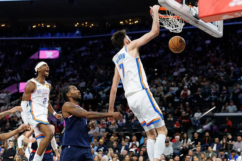 Chet Holmgren #7 of the Oklahoma City Thunder dunks the ball during an NBA game