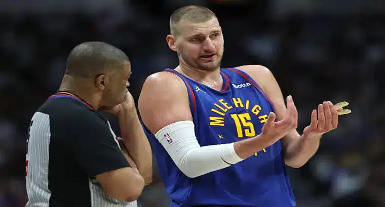Nikola Jokić #15 in Denver Nuggets blue jersey arguing with referee during Clippers vs Nuggets 2025 playoff game