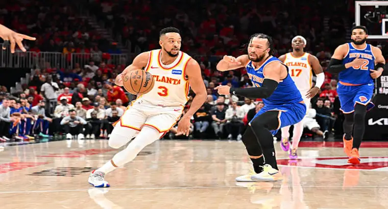 Atlanta Hawks guard CJ McCollum (#3) drives past New York Knicks guard Jalen Brunson during Game 3 of the 2026 NBA Playoffs first round at State Farm Arena, Atlanta, April 23, 2026.
