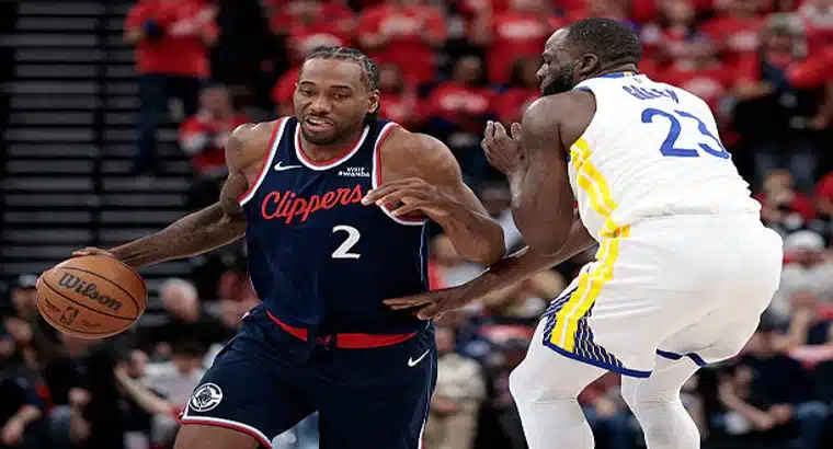 Kawhi Leonard (#2, LA Clippers) driving against Draymond Green (#23, Golden State Warriors) during the 2026 NBA Play-In Tournament at Intuit Dome