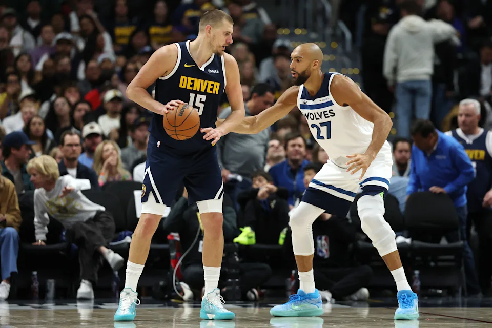 Nikola Jokić holding the ball in the post while Rudy Gobert of the Minnesota Timberwolves defends in the 2026 NBA Playoffs first-round series