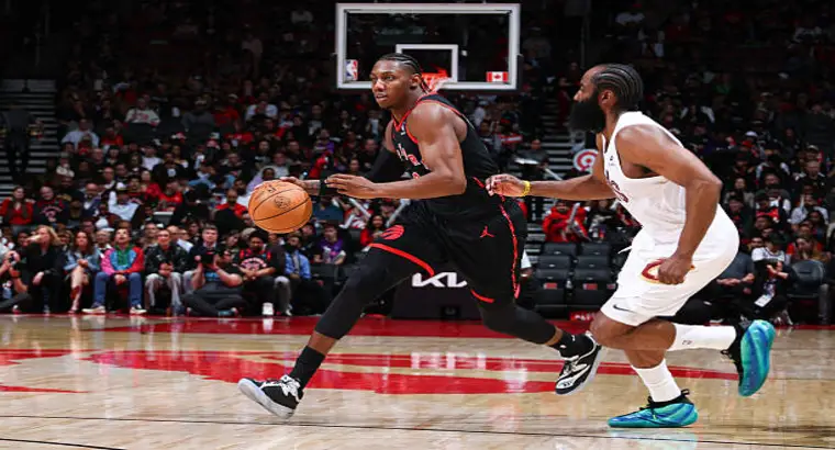 RJ Barrett of the Toronto Raptors drives past a Cleveland Cavaliers defender during Game 3 of the 2026 NBA Playoffs at Scotiabank Arena