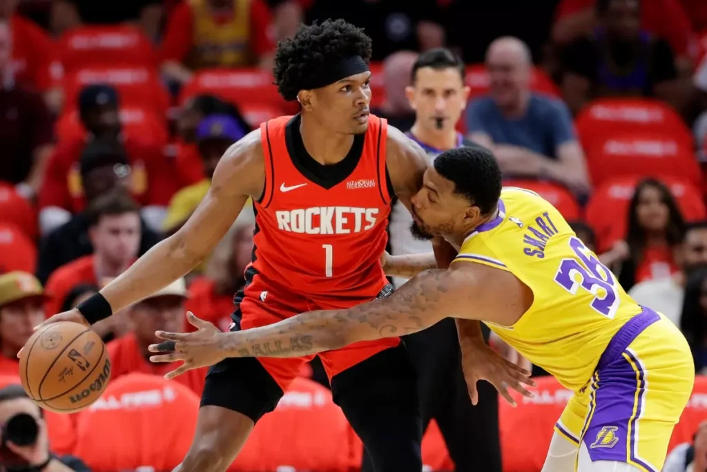 Houston Rockets player #1 dribbling against Lakers defender Marcus Smart #36 during 2026 NBA playoff game
