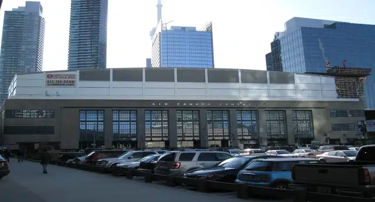 Exterior view of Scotiabank Arena (formerly Air Canada Centre) from Bay Street with public parking lot in the foreground